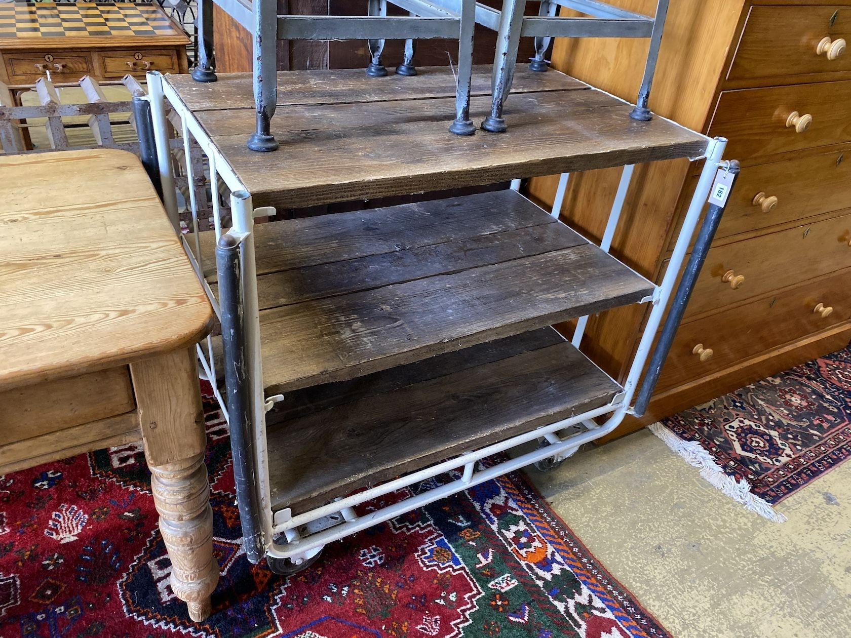 An industrial style tubular metal and wood three tier trolley, width 103cm, depth 68cm, height 96cm